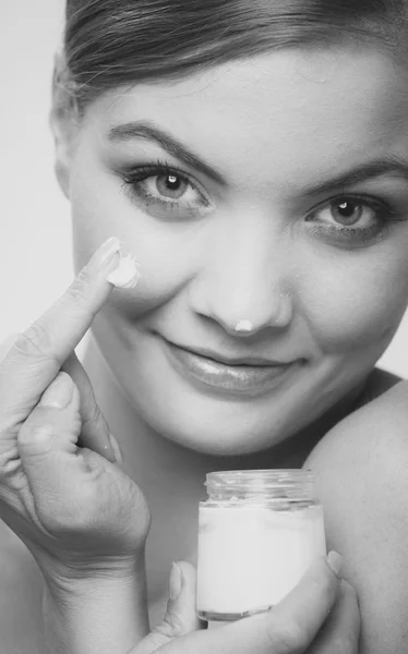 Woman applying cream