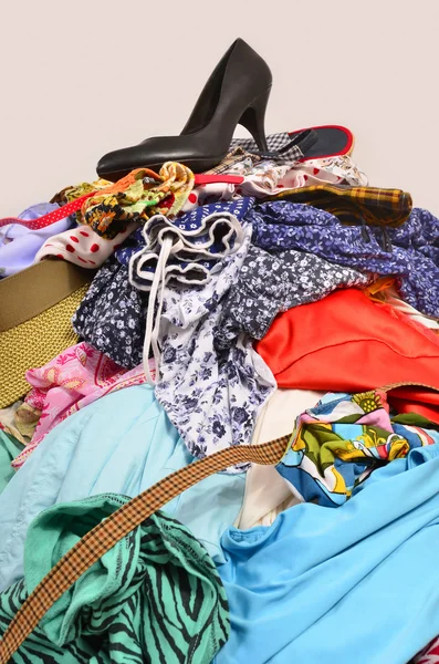 Close up on a big pile of clothes and accessories thrown on the