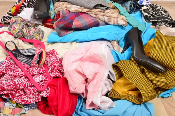 Close up on a big pile of clothes and accessories thrown on the