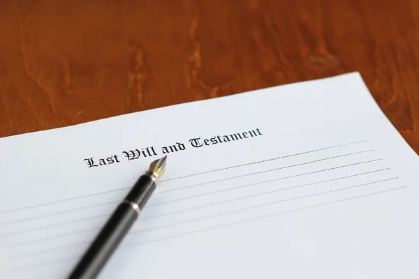 Last will and testament on the white paper with pen
