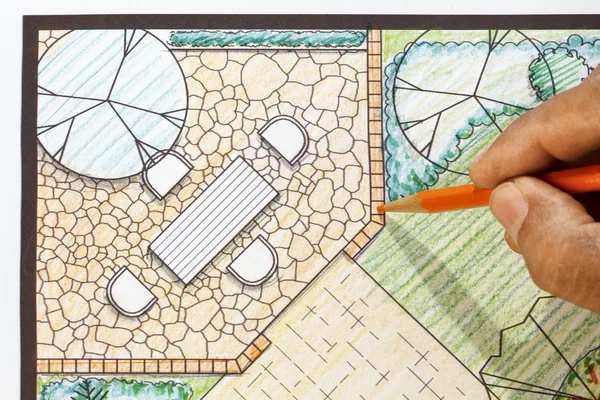 Landscape architect design patio in backyard garden plan.