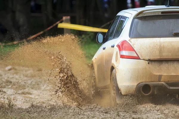 Rally car in muddy road