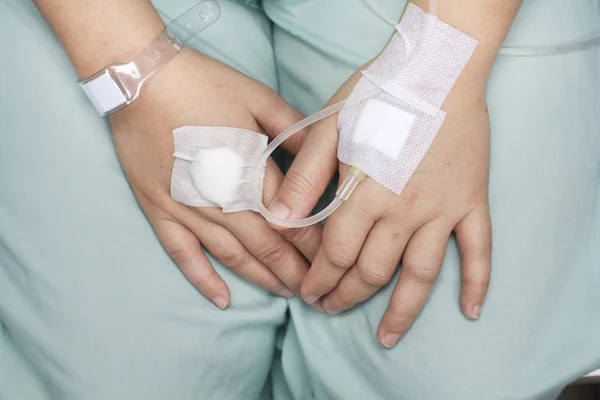 Hand swollen by saline intravenous (iv).