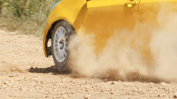 Rally car in dirt track