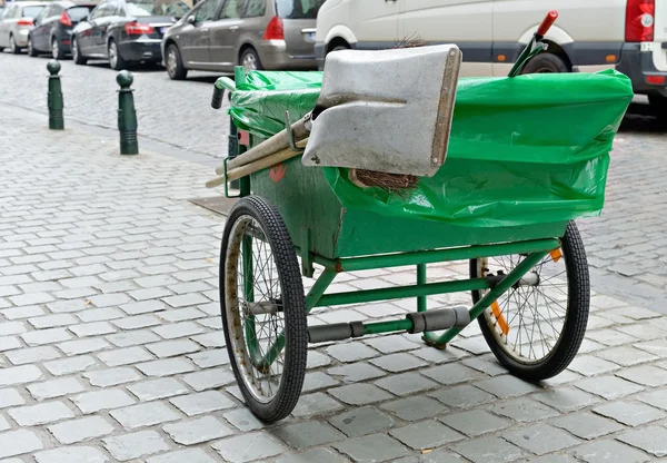 Typical green pushcart of municipal street cleaning service in Brussels