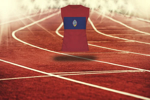 Red running track with lines and Guam flag on shirt