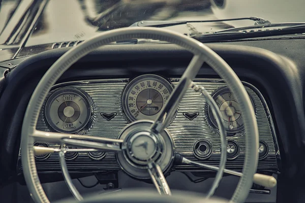 Sleza, Poland, August 15, 2015: Close up on old vintage car steering wheel and cockpit on  Motorclassic show on August 15, 2015 in the Poland