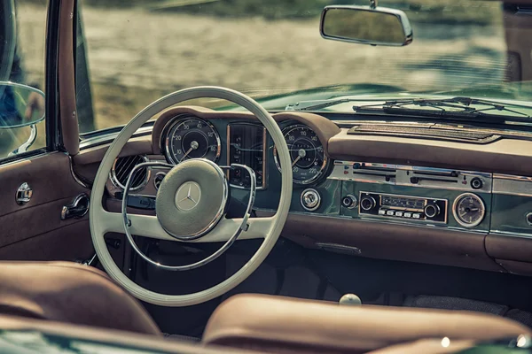 Sleza, Poland, August 15, 2015: Close up on Mercedes vintage car steering wheel and kockpit on  Motorclassic show on August 15, 2015 in the Poland