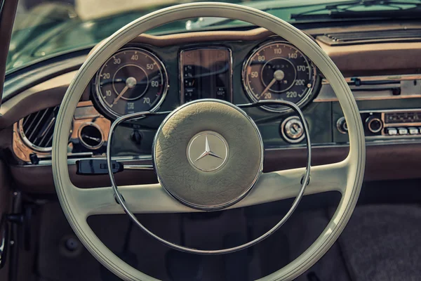 Sleza, Poland, August 15, 2015: Close up on Mercedes vintage car steering wheel and kockpit on  Motorclassic show on August 15, 2015 in the Poland