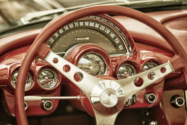 Sleza, Poland, August 15, 2015: Close up on Corvette vintage car steering wheel and kockpit on  Motorclassic show on August 15, 2015 in the Poland