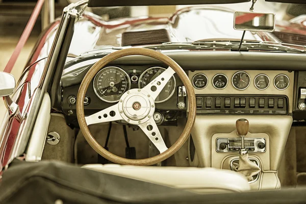 Sleza, Poland, August 15, 2015: Close up on Jaguar vintage car steering wheel and kockpit on  Motorclassic show on August 15, 2015 in the Poland