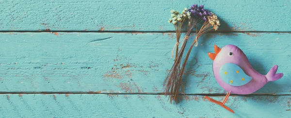 Website banner background of dried colorful flowers on old blue wooden background