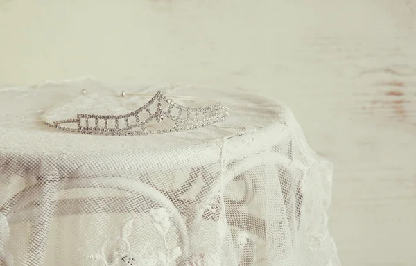 Diamond tiara on vintage table. selective focus