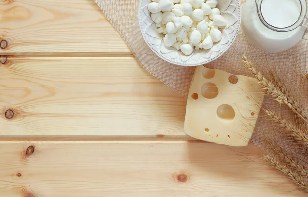 Image of dairy products on wooden table. Symbols of jewish holiday - Shavuot