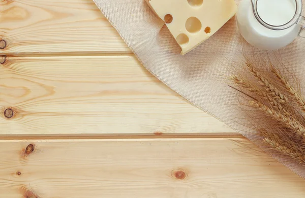 Image of dairy products on wooden table. Symbols of jewish holiday - Shavuot