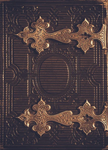 Top view of antique book cover, with brass clasps