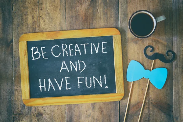 Chalkboard with the phrase: be creative and have fun