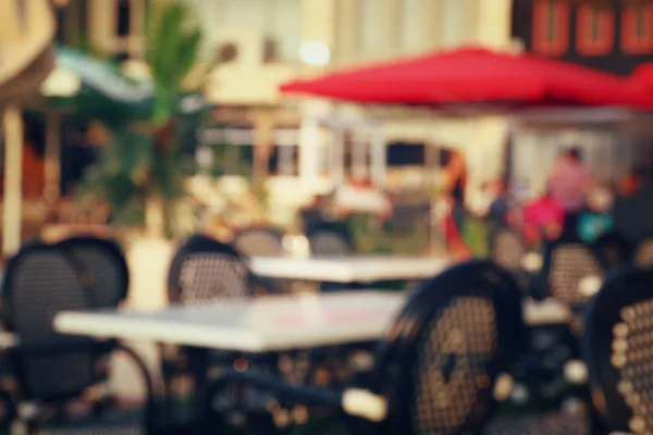 Abstract image of blurred street view of cofee shop