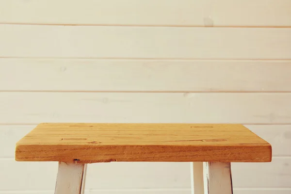 Empty small table in front wooden wooden planks background