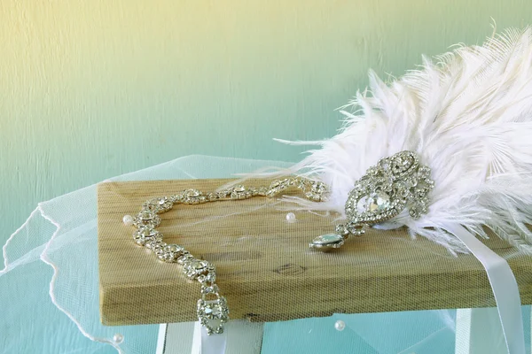 Image of gatsby style diamond head decoration with feathers