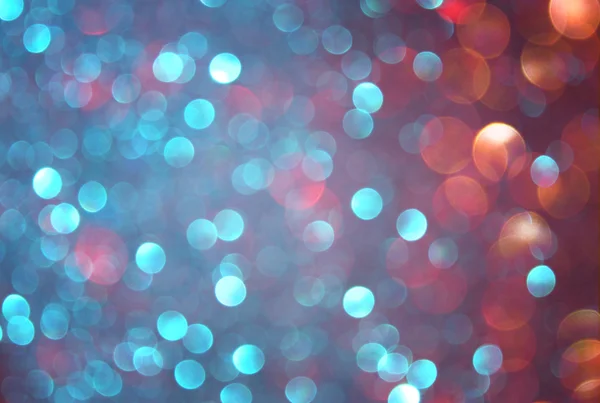 Glitter vintage lights background. blue, brown and purple mixed colors. defocused