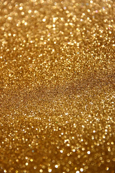 Glitter vintage lights background. abstract gold background . defocused