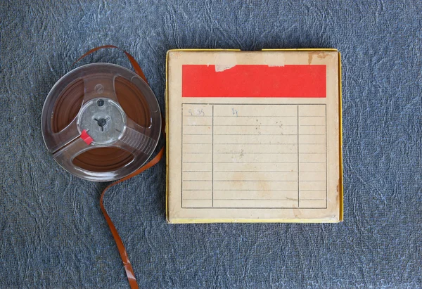 Top view of  old sound recording tape, reel to reel type and box with room for text. filtered image
