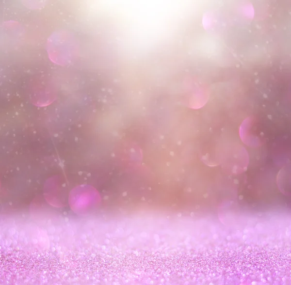 Abstract photo of light burst among trees and glitter bokeh lights. image is blurred and filtered .