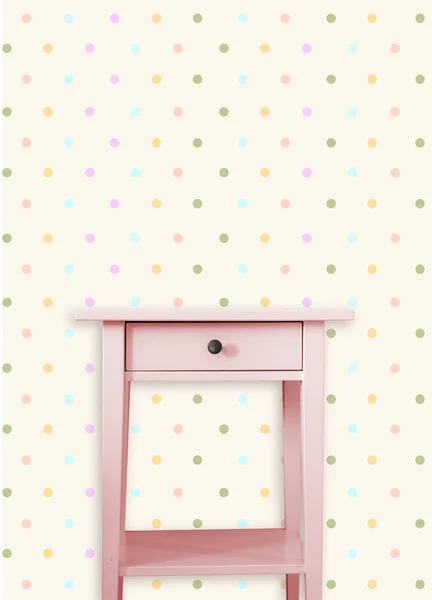 Vintage pink wooden chest drawer near vintage dots wall