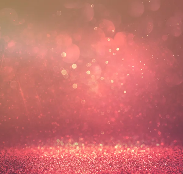 Glitter vintage lights background. gold, red and purple. defocused