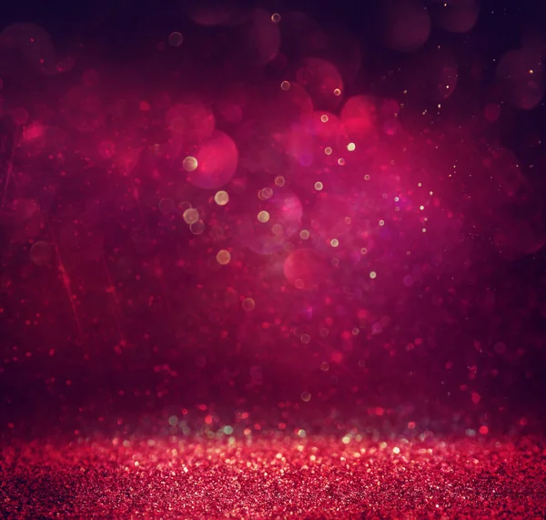 Glitter vintage lights background. gold, red and purple. defocused