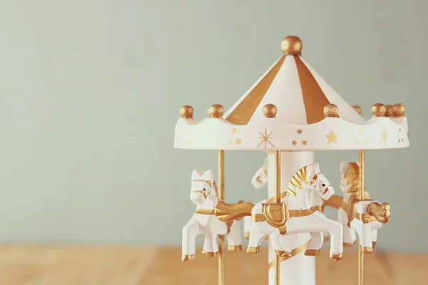 Vintage white carousel with horses