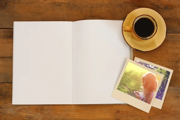 Open blank notebook and photos