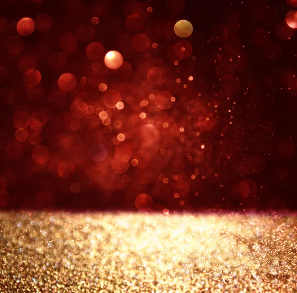 Abstract background of red and gold glitter bokeh lights