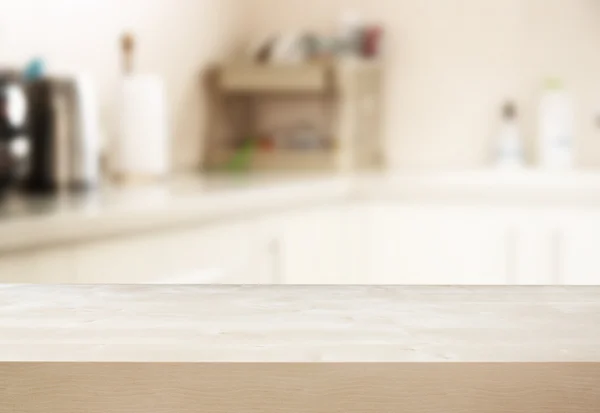 Table and white kitchen background.