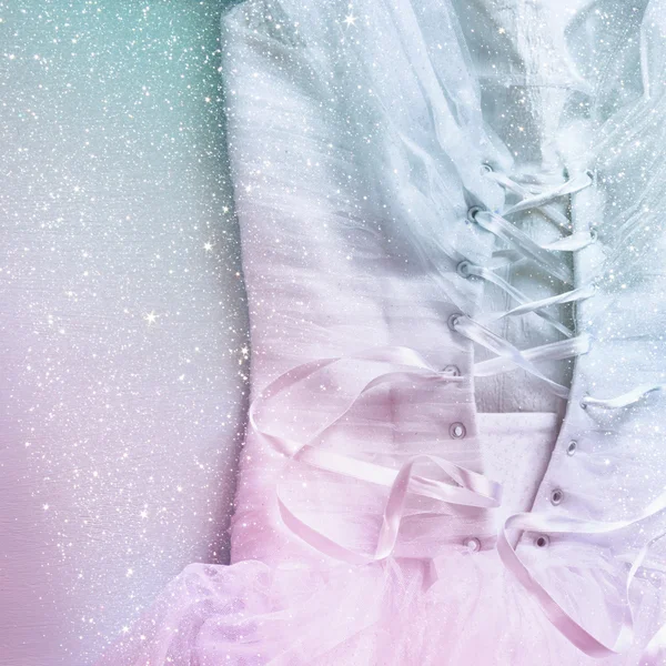 Vintage wedding dress corset background with glitter overlay. wedding concept. vintage filtered and toned image with glitter overlay.