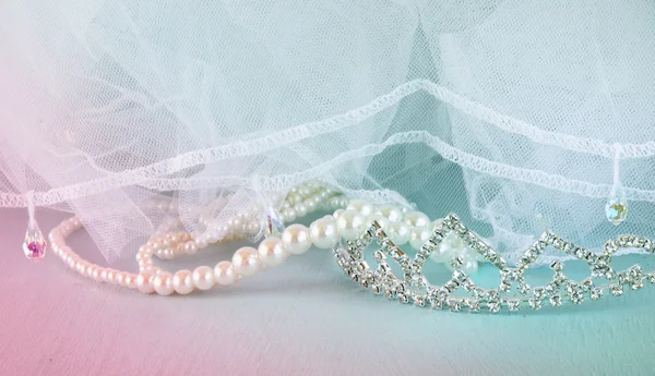 Wedding vintage crown of bride, pearls and veil. wedding concept. retro filtered and toned