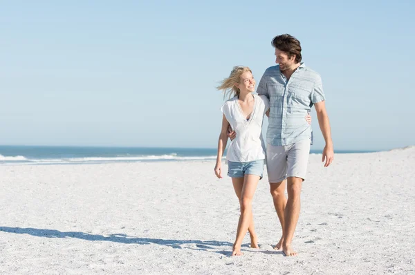 Couple walking at beach