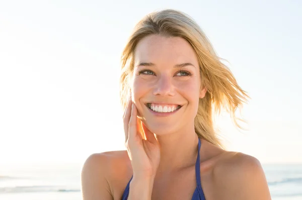 Beautiful young woman at beach