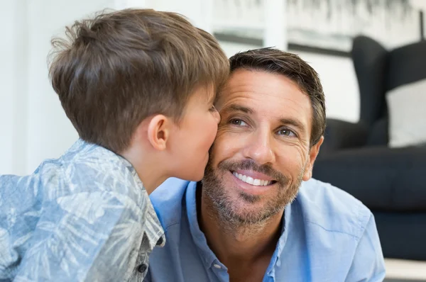 Son kissing father