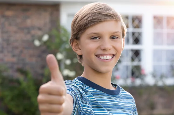 Boy giving thumb up