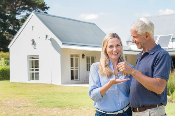 New home owners with key