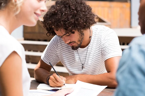 Young man writing