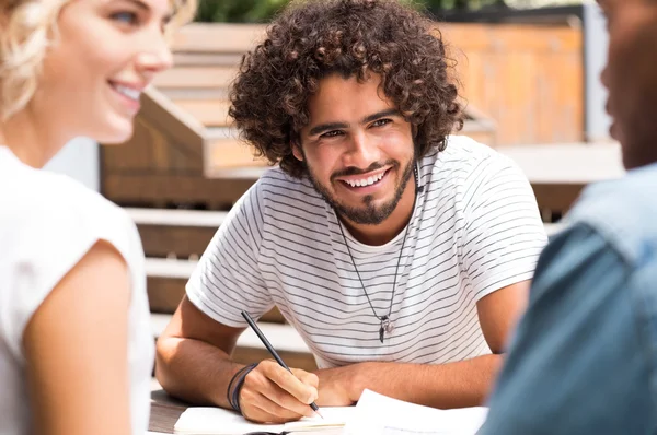 Student laughing and studying