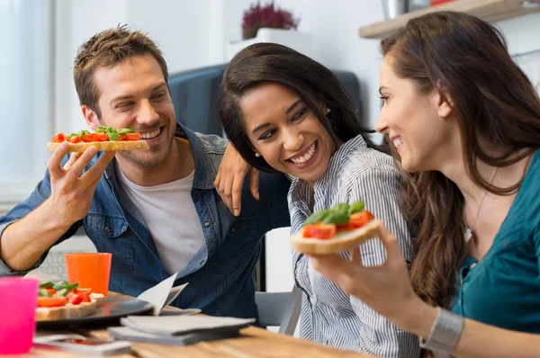 Friends eating bruschetta