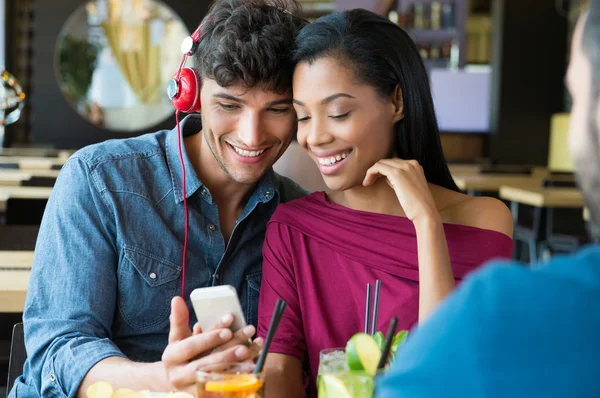 Couple listening to music at bar