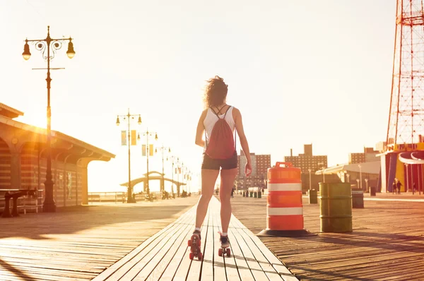 Woman skating on road