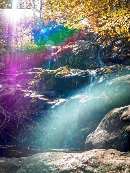 Rainbow Waterfall and Cross