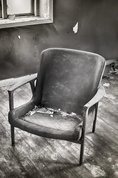 Abandoned room with chair.