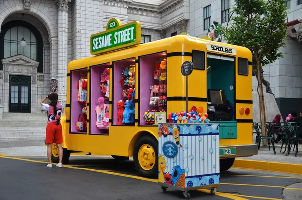 Yellow truck that sells Sesame Street merchandise